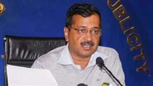 Image of Arvind Kejriwal addressing a crowd at a political rally. Alt text: "Arvind Kejriwal speaking at a political rally."