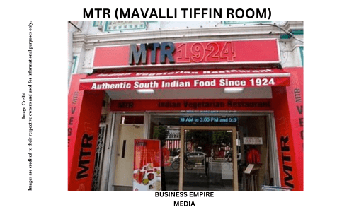 Traditional interior of MTR restaurant with classic wooden furniture and nostalgic decor. The setting reflects MTR's rich heritage and commitment to authentic South Indian cuisine, including dosas and idlis.