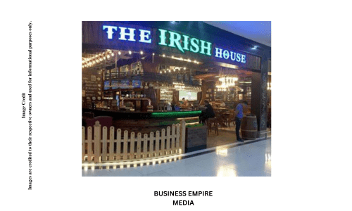 Interior of The Irish House, featuring warm wooden furnishings, vintage decor, and dim lighting, creating an authentic Irish pub atmosphere with a cozy and inviting vibe.